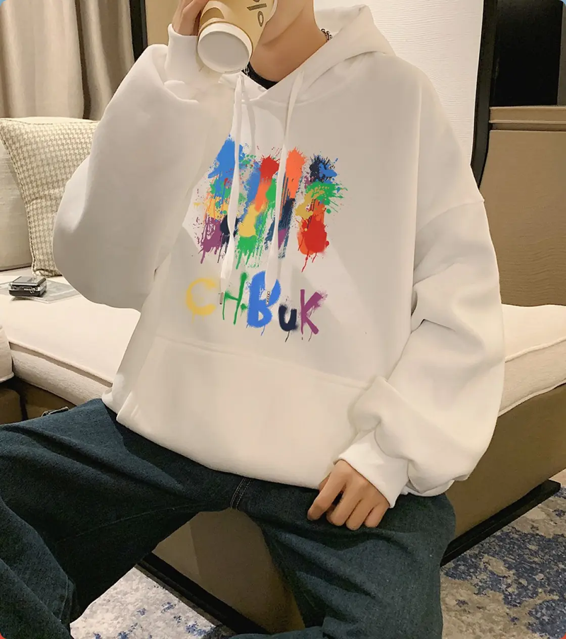 White hoodie with print on the front