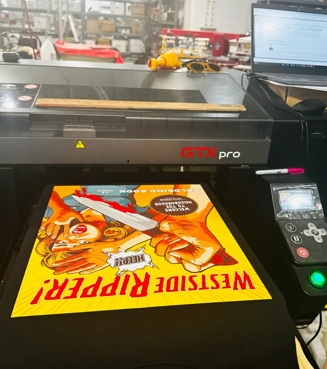 Black color printed t-shirt in DTG printing machine